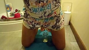 she wets herself while masturbating with dildo in bedroom