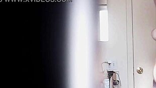 Blonde woman with big boobs is changing her clothes