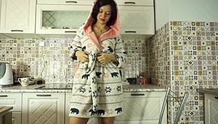 Beautiful brunette milf with short hair moans softly while masturbating in the kitchen during naughty solo session