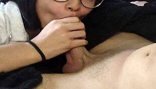 intriguing brunette couple enjoys sloppy oral on veiny monster cock seated on sofa