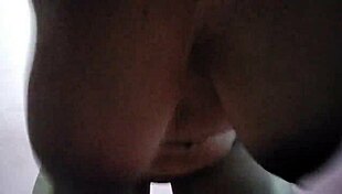 Aunty squeezes her huge natural tits at home office