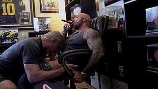 Jason Collins, the muscular biker, enjoys a blowjob while smoking a cigar.