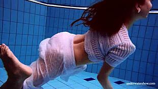 redhead marketa in a white dress in the pool