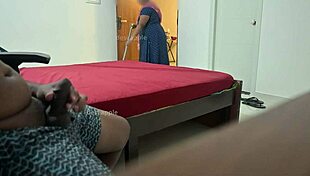 Maid Flashes Ass While Performing Handjob for Owner