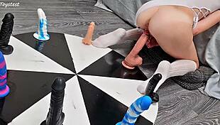 The petite stepsister spins the wheel of dildos and achieves her orgasm