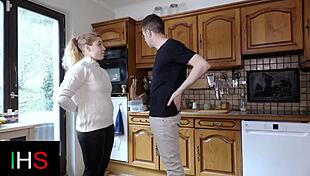 Blonde milf prepares meal in kitchen