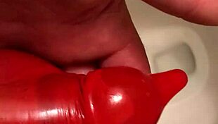 In this condom piss series part two, he fills the rubber with his urine.