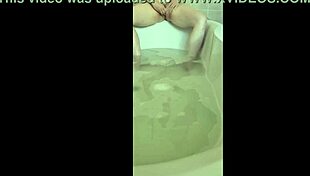 she's in the bath, getting all horny and reaching that solo orgasm.