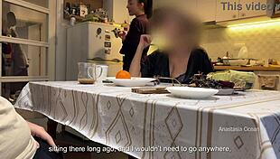 In the kitchen, my husband jerks under the table in front of my step mom and me