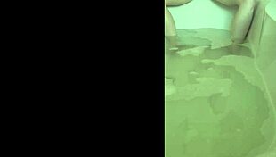 she's in the bath, getting all horny and reaching that solo orgasm.