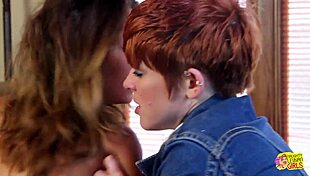 a redhead lesbian fucks brunette with strapon while girlfriend's away