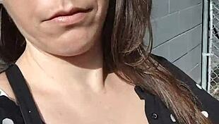 kelly kendricks smokes in the sun, showing lots of cleavage 😎