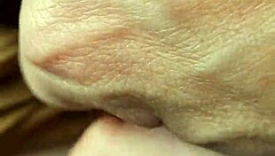 A braless woman reveals her nipple