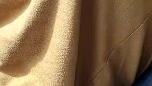 A braless woman reveals her nipple