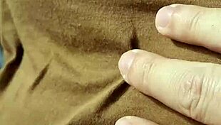 A braless woman reveals her nipple