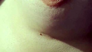 A braless woman reveals her nipple