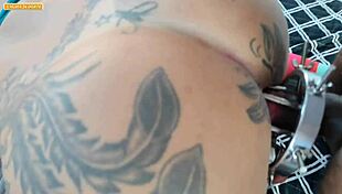 In an adult game, one friend prepares her ass for anal fucking by a big black cock.