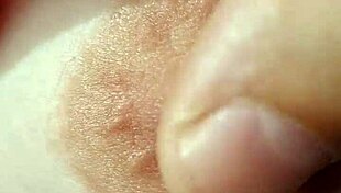 A braless woman reveals her nipple