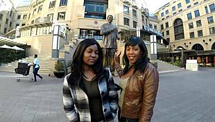 ebony lesbians kiss passionately in shower after shopping