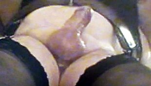 latex-clad beauty sucking on a hard cock