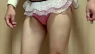 Cute maid in uniform and underwear plays with her anus.