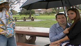 brunette woman enjoys intimate massage on bed