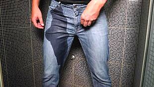 Guy Pees Inside His Jeans and Finishes with a Cumshot Outdoors