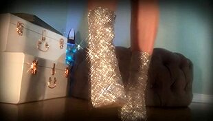 mesmerizing her slave with sparkling boots in femdom domination