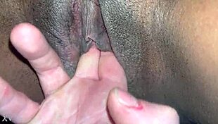 Black wet pussy fingered by white guy in contrasting interracial scene.