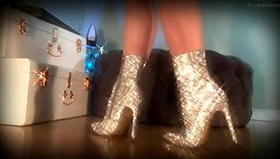 mesmerizing her slave with sparkling boots in femdom domination