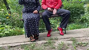 Mature woman handles huge shaft outdoors into glass