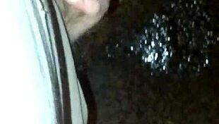 guy sneaks a pee on the empty street corner