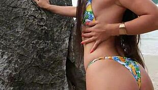 pretty tanned girl flashes bikini legs while dancing on hidden beach spot