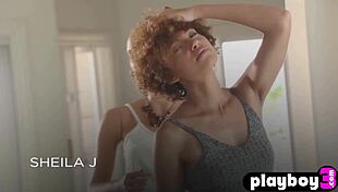 Curly black model reveals her attractive body after captivating striptease