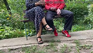 Mature woman handles huge shaft outdoors into glass