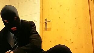 guy strokes his cock hard in tight business suit on bed