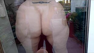 Desperate Housewife Fucks Dildo Against Window to Orgasm