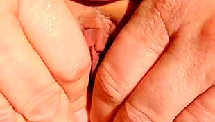 uhh sexy mature fingers spreads her bald wet cunt close up