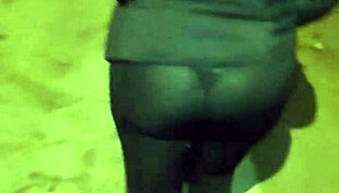 curvy mature whore flashes huge ass in see-through leggings on street