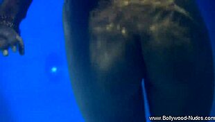 A sultry brunette from wild india sways erotically stripping nude teasing every curve