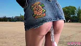 Miniskirt boots slut climaxes hard on outdoor anal vibrator