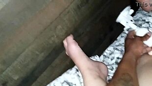 close-up view of hubby sliding dildo deep into wife's shaved wet pussy