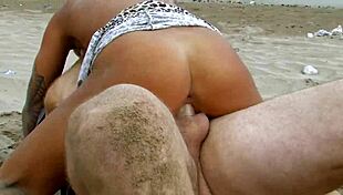 short haired tattooed milf bends over beach for big cock doggystyle creampie