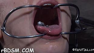 brunette slave writhes as toy plunges her dripping slit