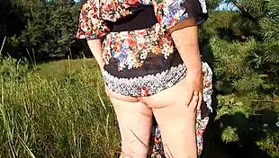 hairy chubby mature flashes pussy on crowded nudist beach