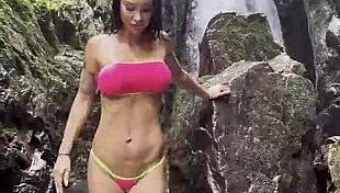 monika fox pink top yellow shorts strips jungle waterfalls nude