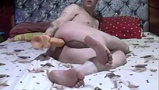 Naked bisexual shoves huge dildo deep in asshole!