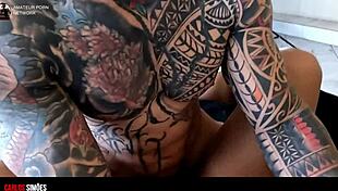 tattooed hunk gives young brunette a cock treat at home