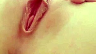 cute teen blonde spreads her tight pink pussy lips wide open