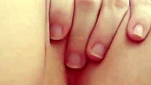 cute teen blonde spreads her tight pink pussy lips wide open